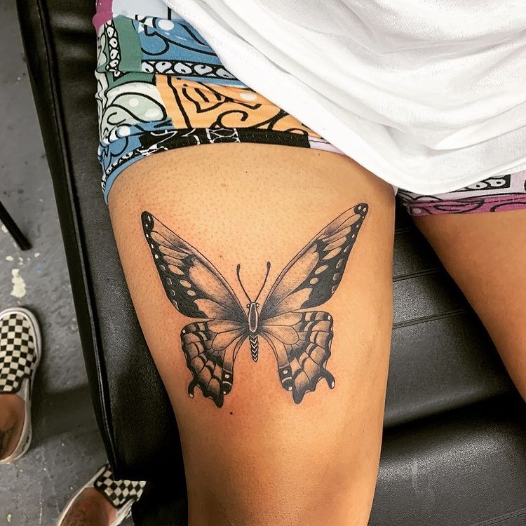 travel thigh tattoo